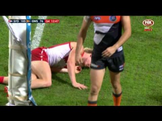 Aussie Rules footballer gets smashed by the goal post.
